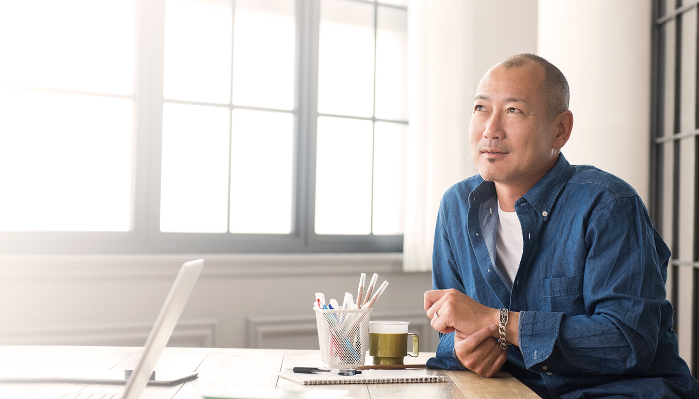 optimistic man at desk