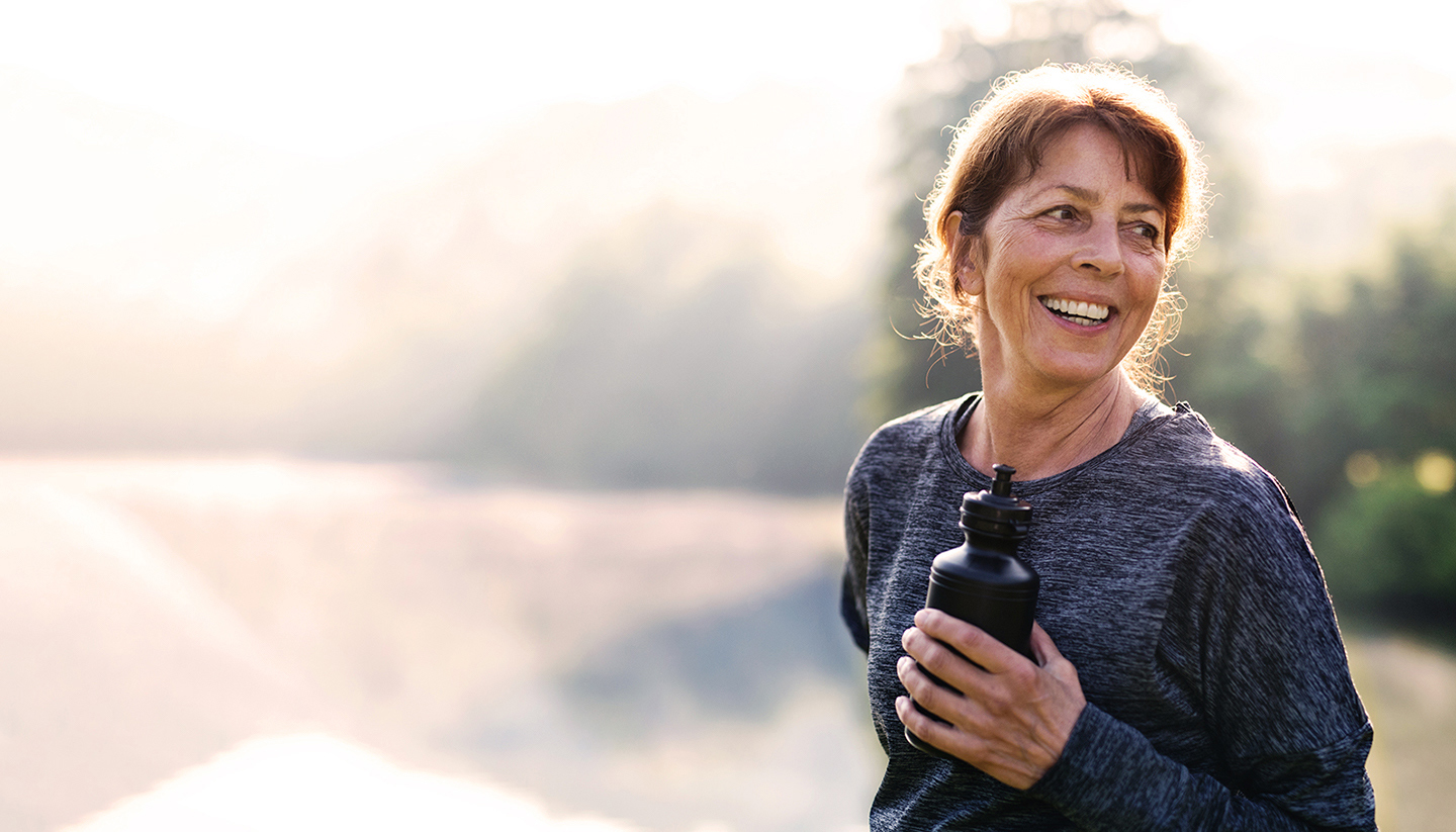 woman outdoors with water bottle